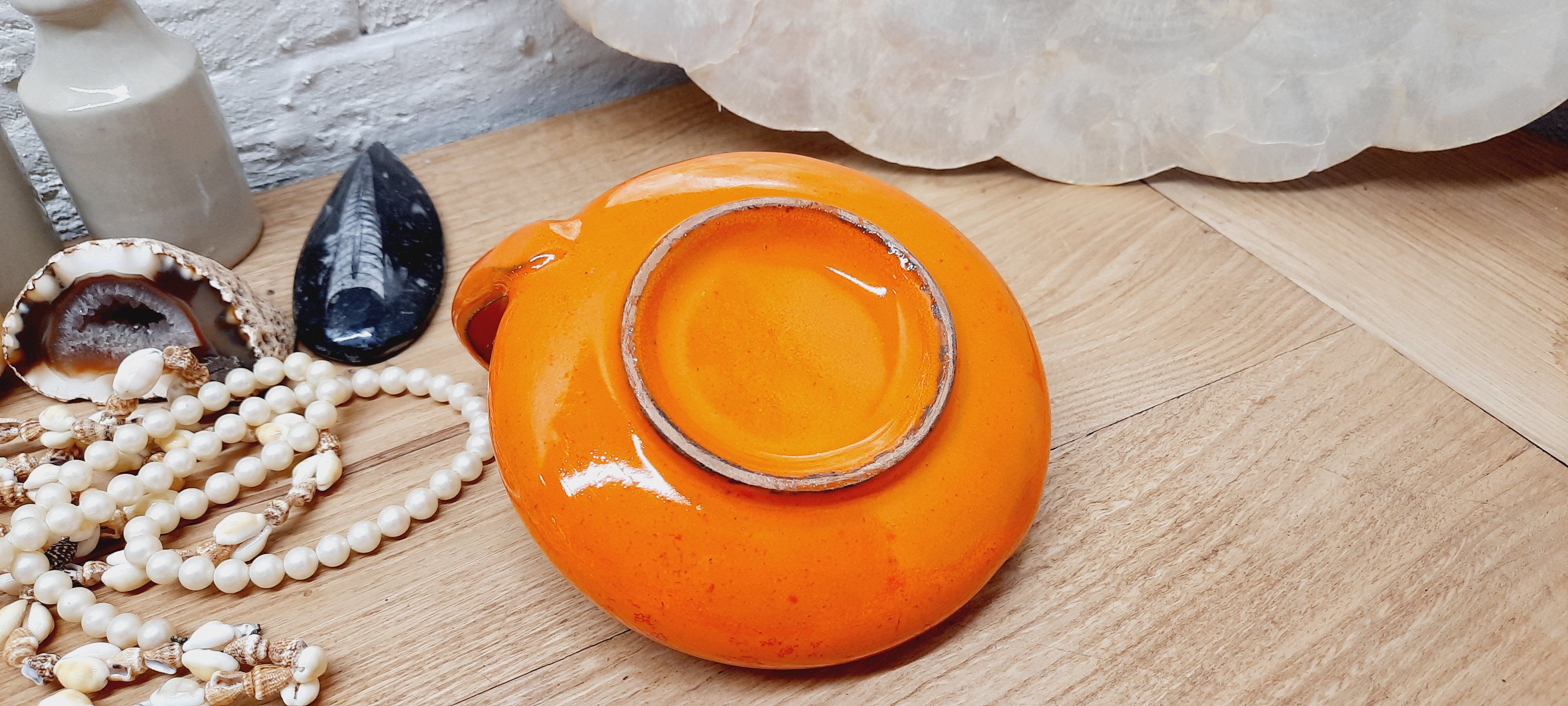 Orange cellar rat candle holder