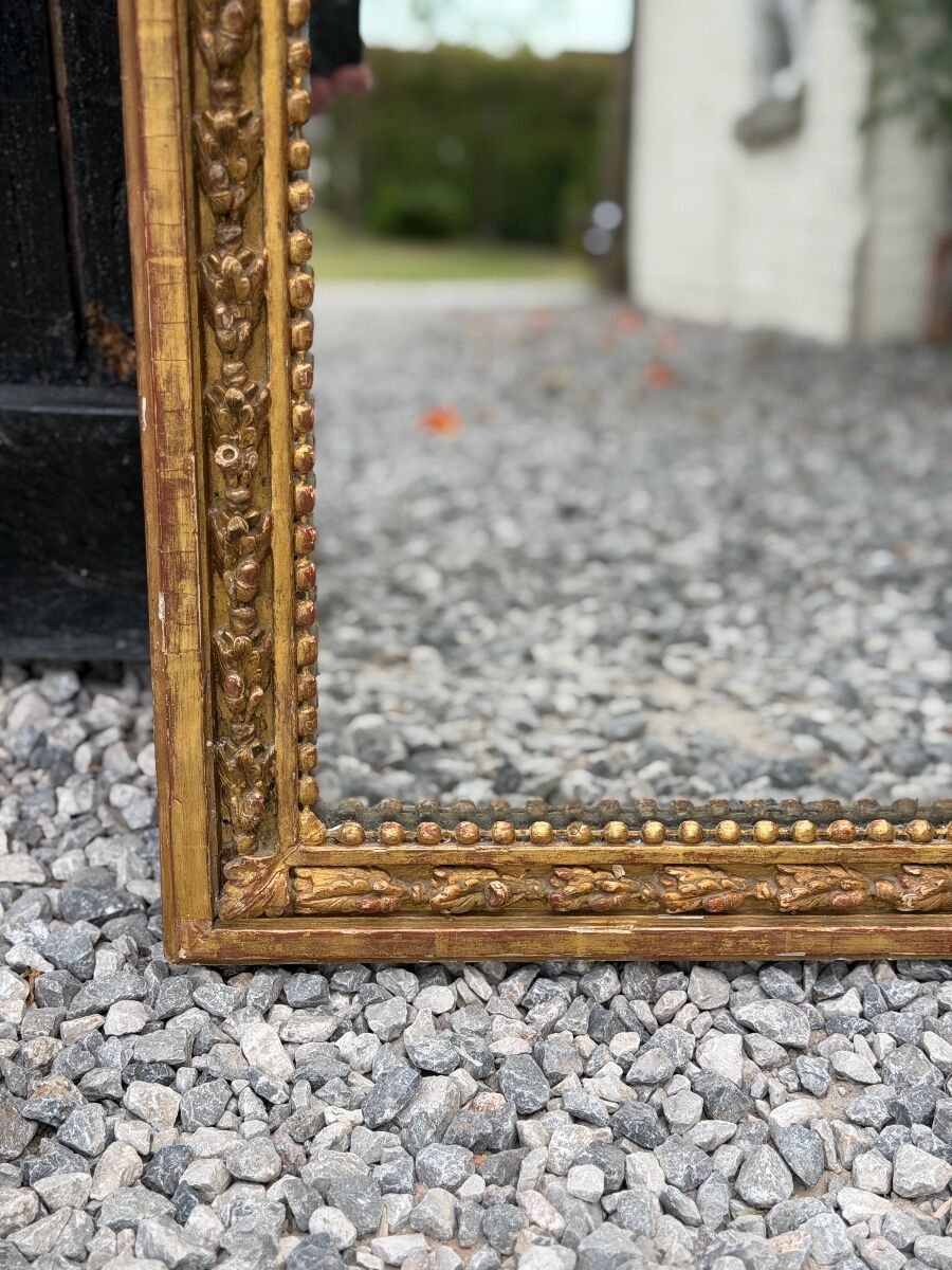 Louis XVI mirror in carved and gilded wood, 18th century
