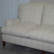 Howard & Sons canapé with feather cushions and ticking fabric, Victorian style.