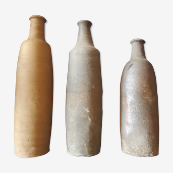 3 terracotta bottles