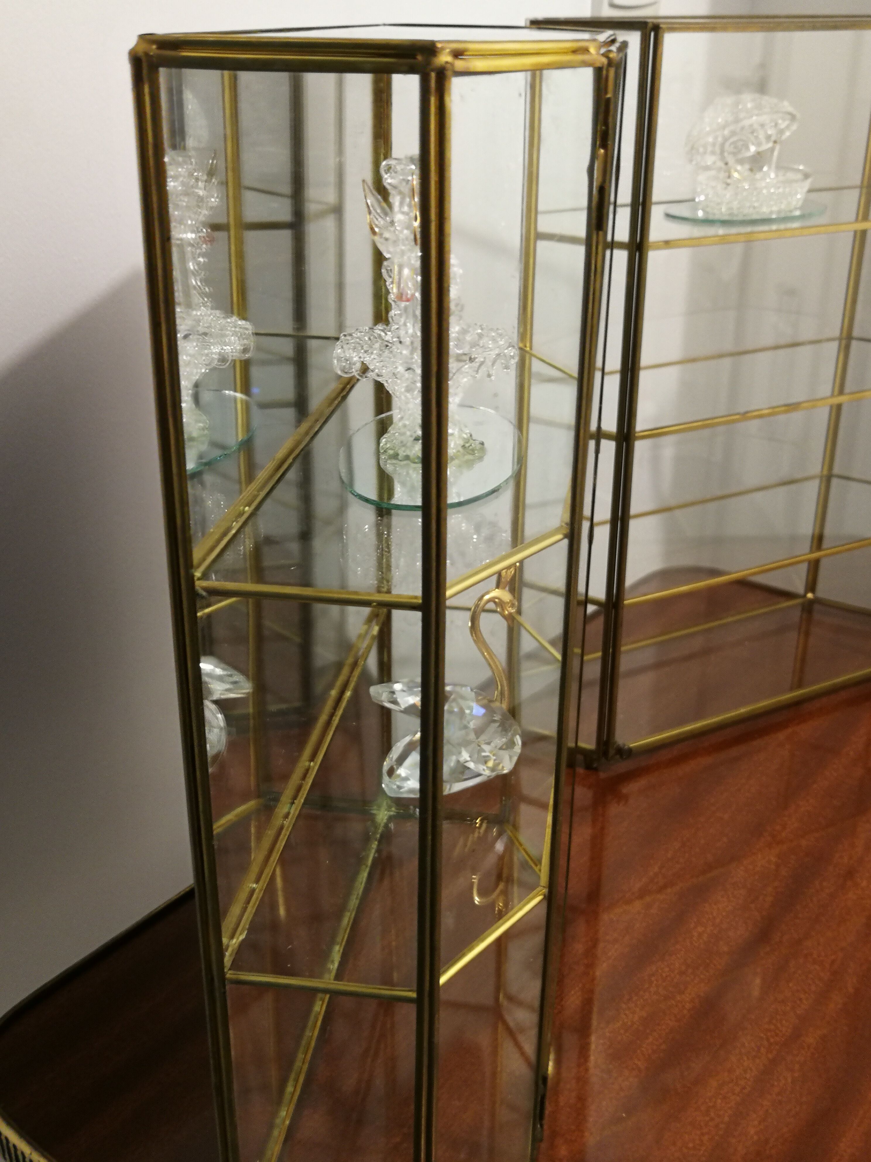 Duo of brass and glass showcases