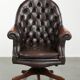 Brown cow leather Chesterfield office chair on wheels in English style