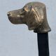 Pair of metal chenets decorated with brass dog heads