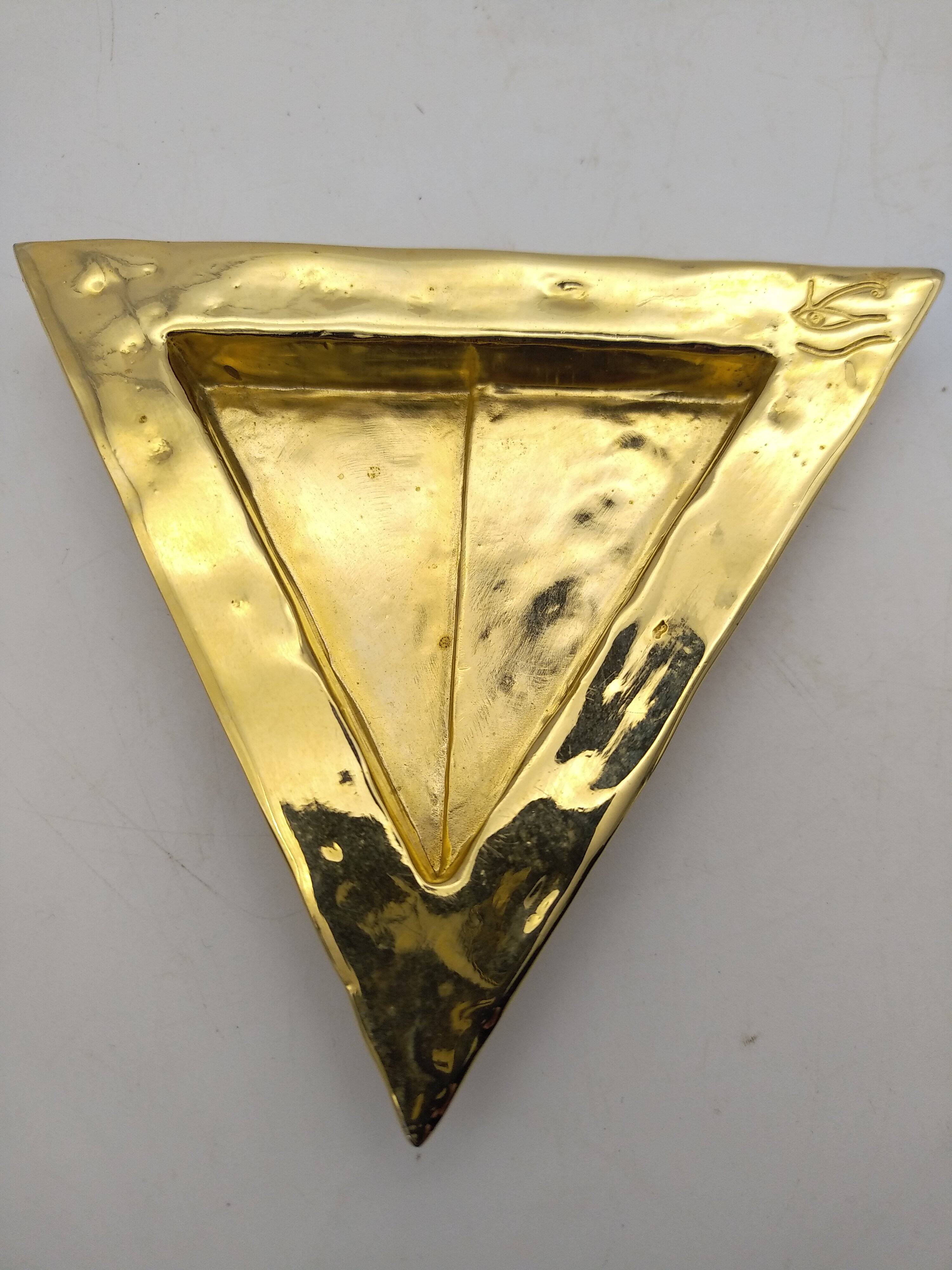 Cecile & jeanne: triangular gold-plated metal pocket tray with hieroglyph decoration.