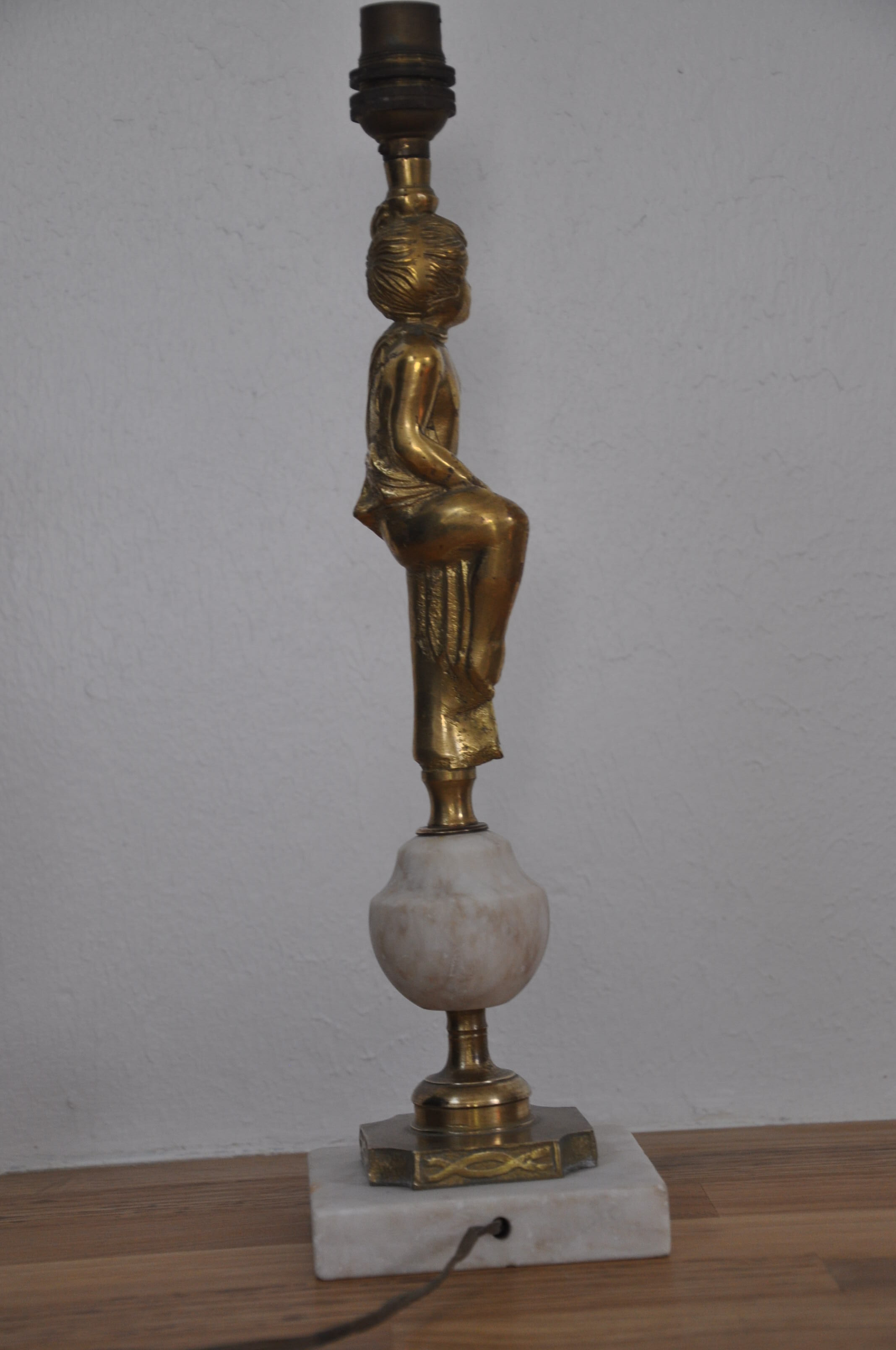 Ancient alabaster lamp and bronze cherub decoration