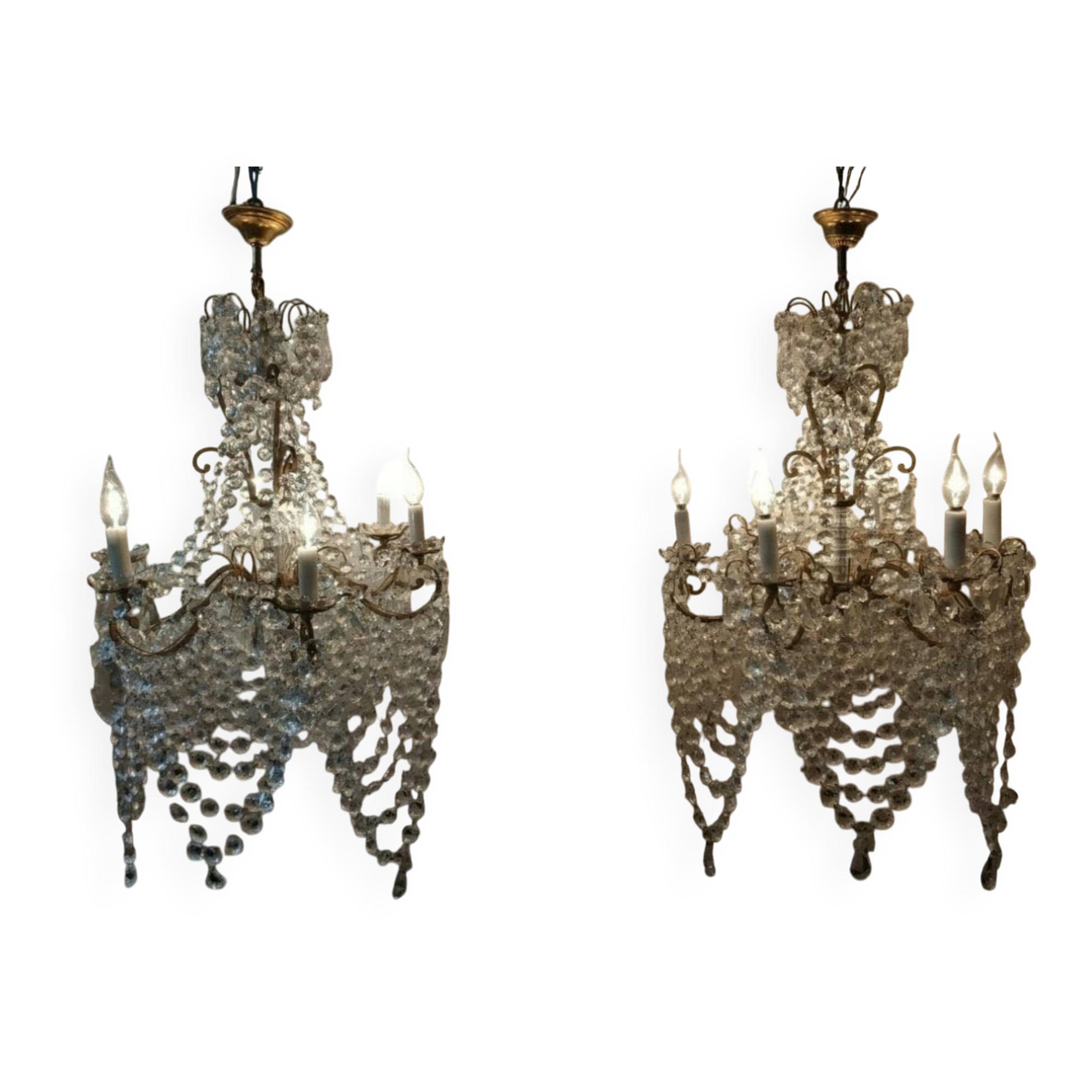 A pair of imposing, antique chandeliers with pendants.