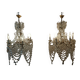 A pair of imposing, antique chandeliers with pendants.