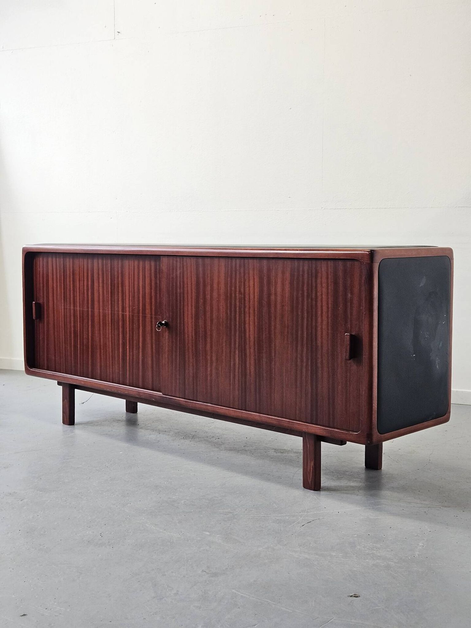 Vintage enfilade in teak and leather, 1970s.
