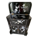 Black lacquered artisanal bar with mother-of-pearl inlays.