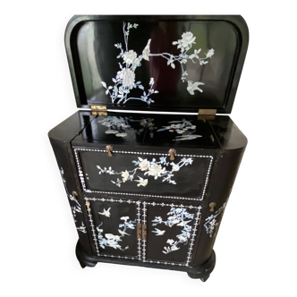 Black lacquered artisanal bar with mother-of-pearl inlays.