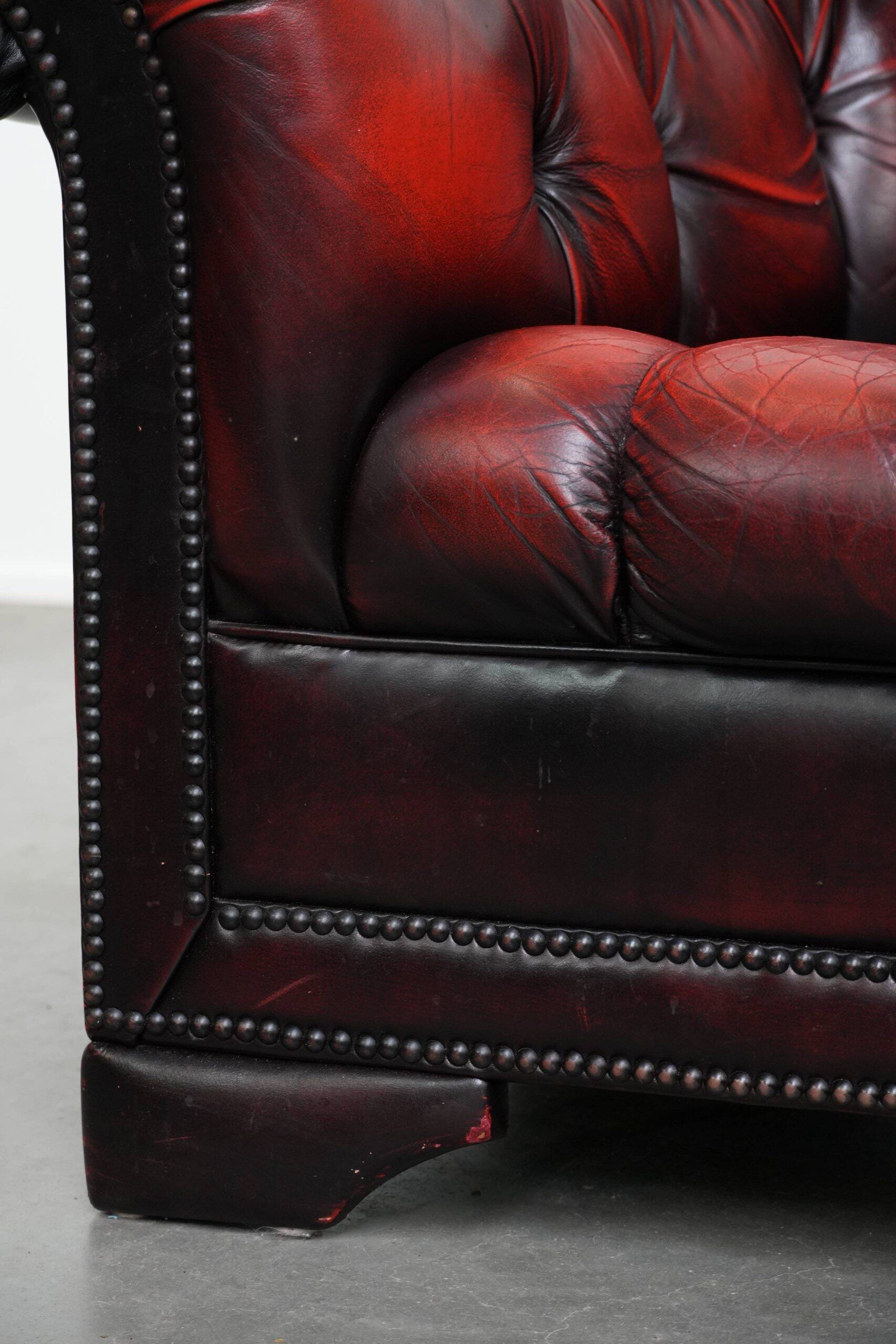 Classic cowhide Chesterfield button seat armchair in a beautiful red colour