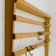 Grand coat rack Auböck Carl Mid-Century in beech with 8 brass hooks, 1950s.