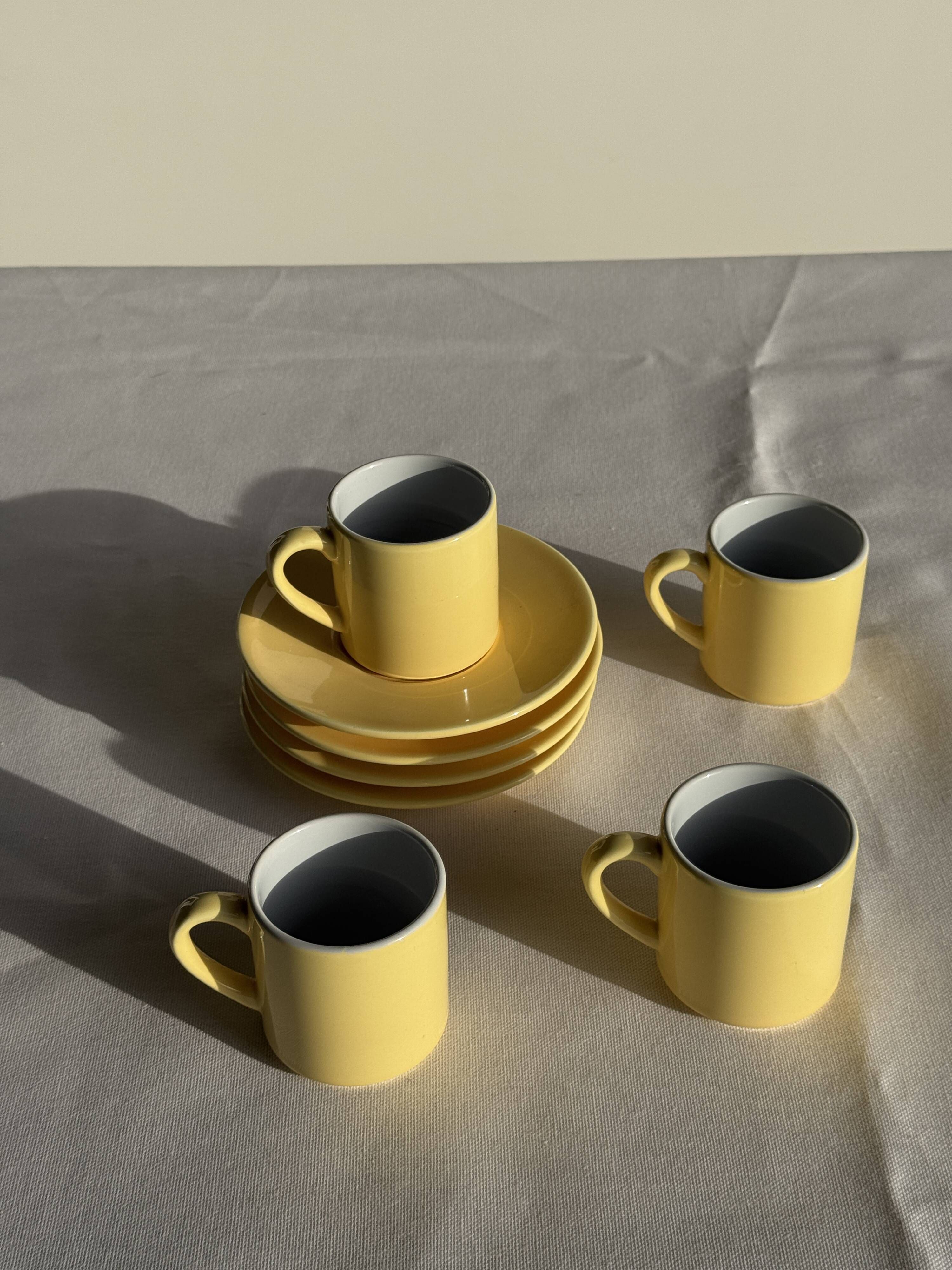 Set of 4 vintage yellow Italian espresso cups and saucers.