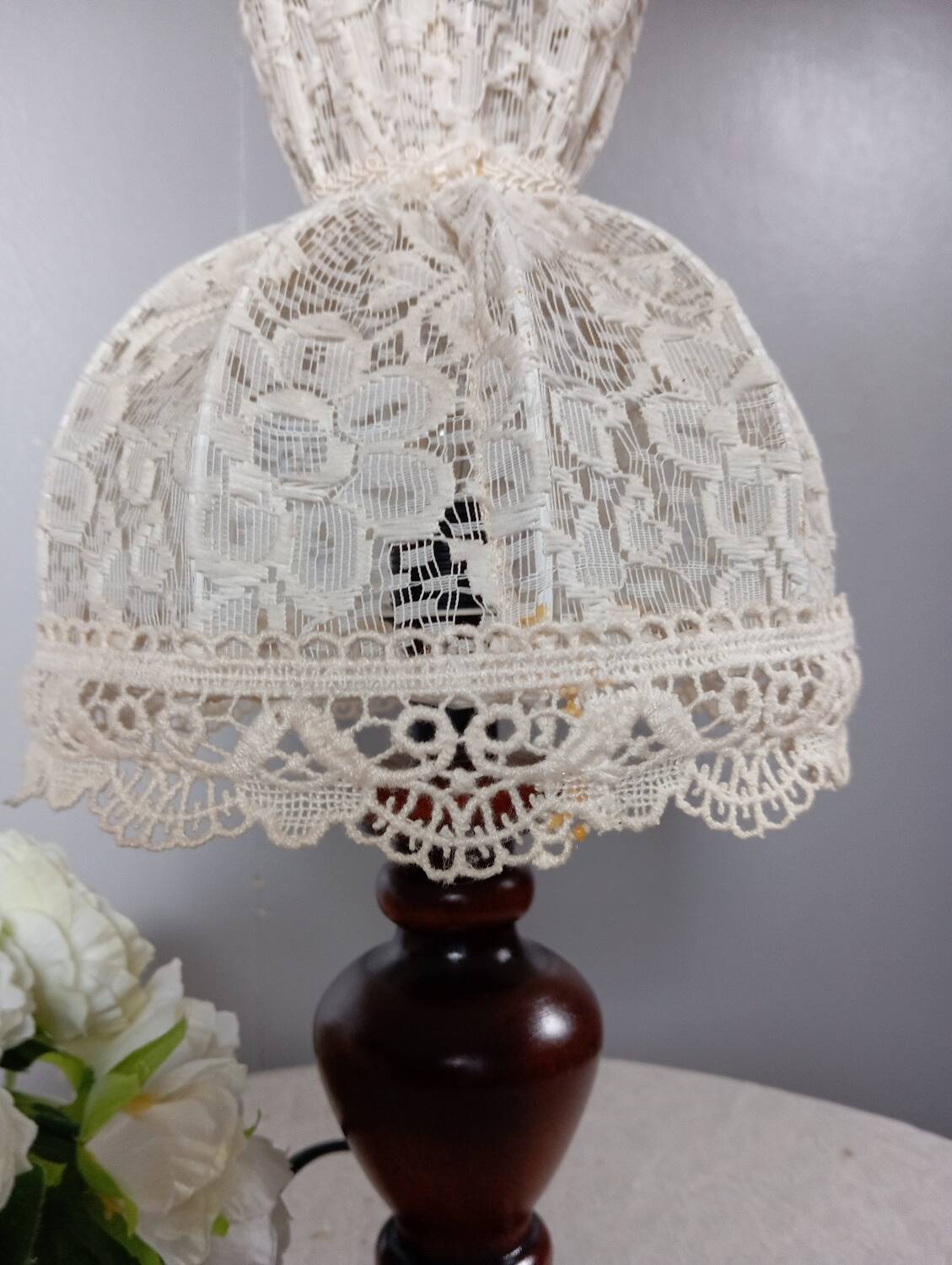 Table lamp with romantic wood and lace ambiance, retro chic