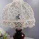Table lamp with romantic wood and lace ambiance, retro chic