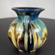 Black ball vase with handle, yellow blue marbled