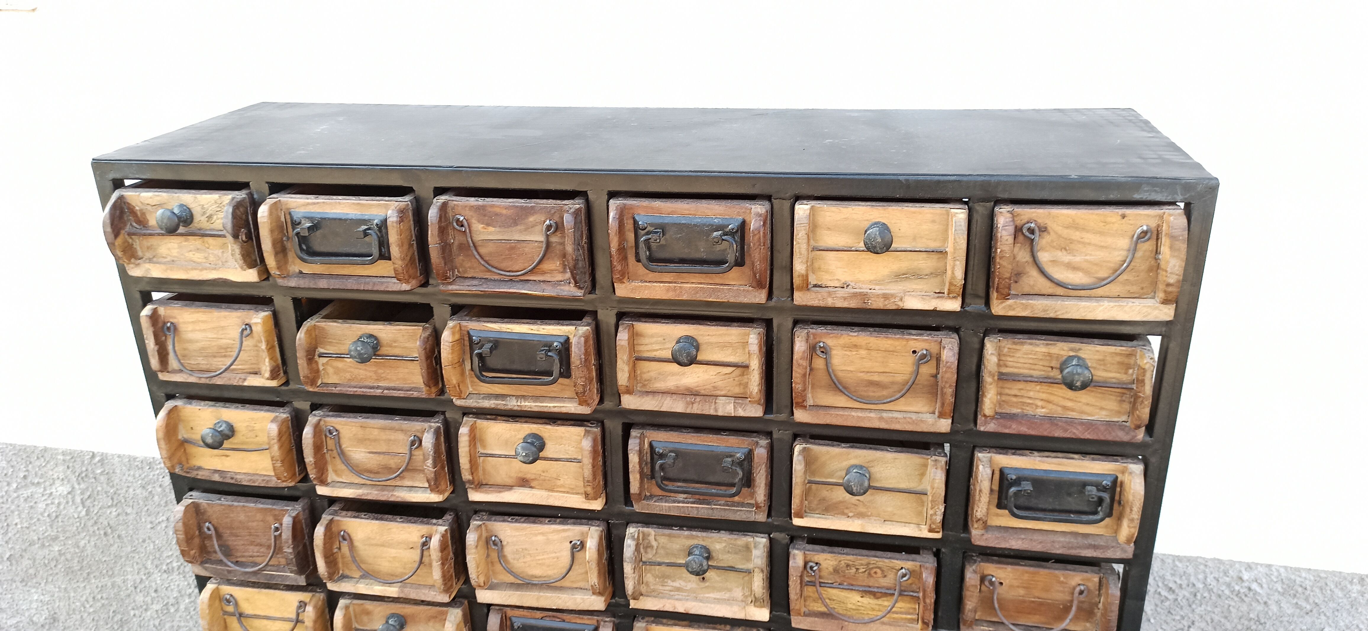 Black metal storage cabinet with 60 wooden drawers