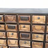 Black metal storage cabinet with 60 wooden drawers
