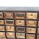 Black metal storage cabinet with 60 wooden drawers