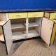 Vintage yellow sideboard, and black marble top.