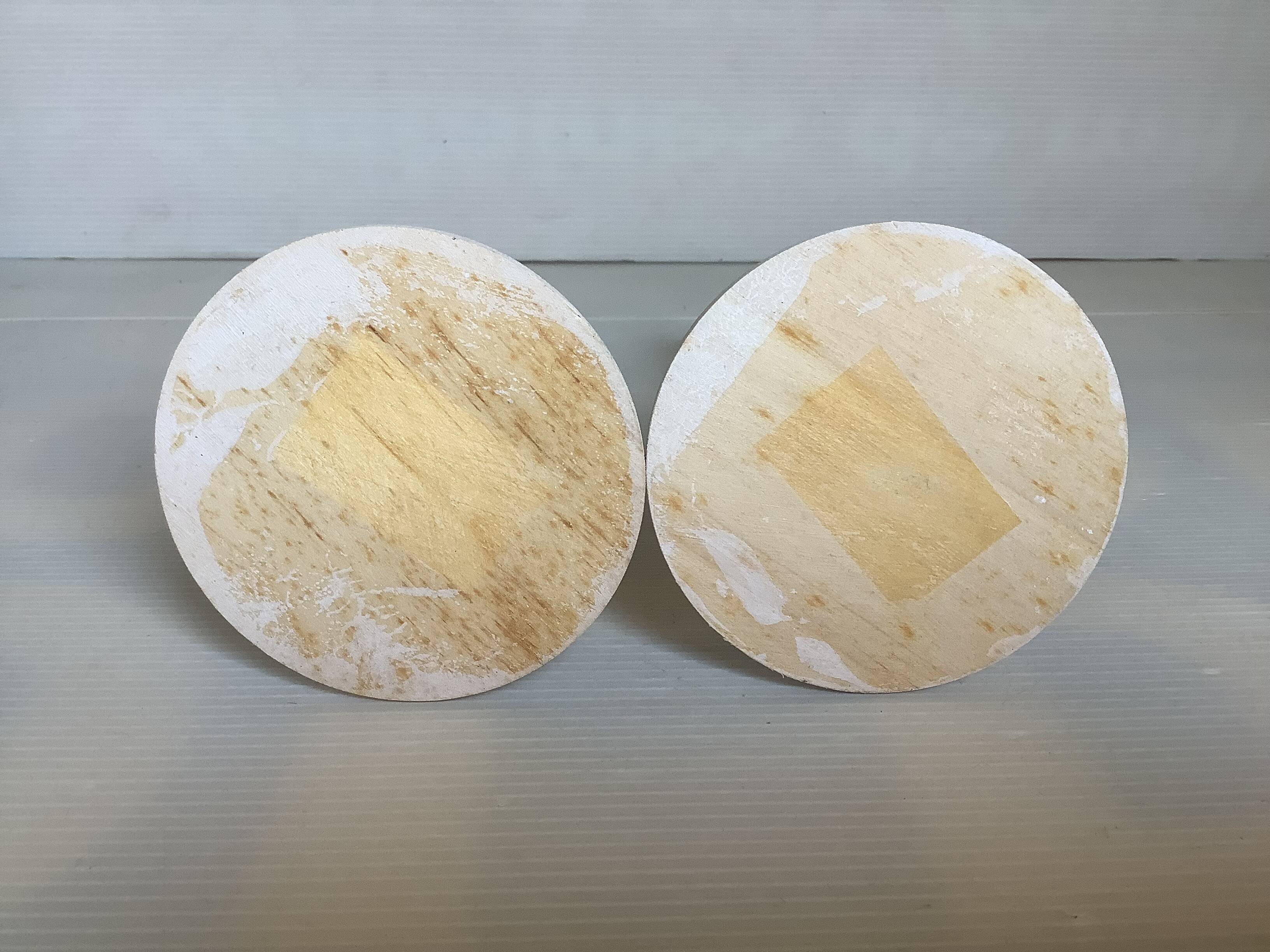 Pair of painted wooden candlesticks