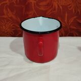 graduated measuring pitcher in red enamelled sheet metal