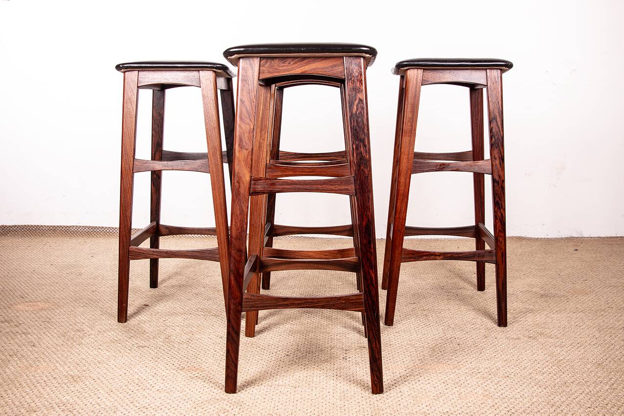 4 Danish high stools, rosewood and black leather, Knud Bent for Dyrlund.