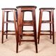 4 Danish high stools, rosewood and black leather, Knud Bent for Dyrlund.