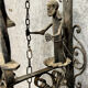Wrought iron entrance bell depicting a monk ringing a bell circa 1900-1930