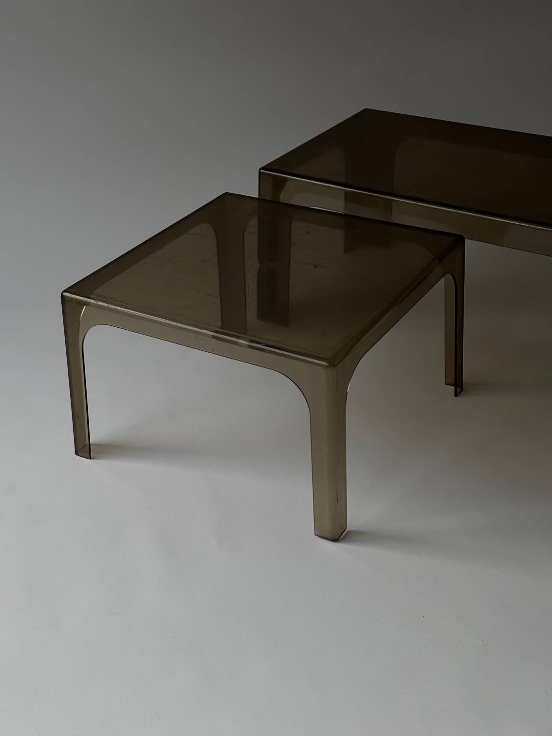 Smoked plastic coffee tables 1970