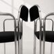 Vintage chairs with double chrome structure and black velvet. 70s