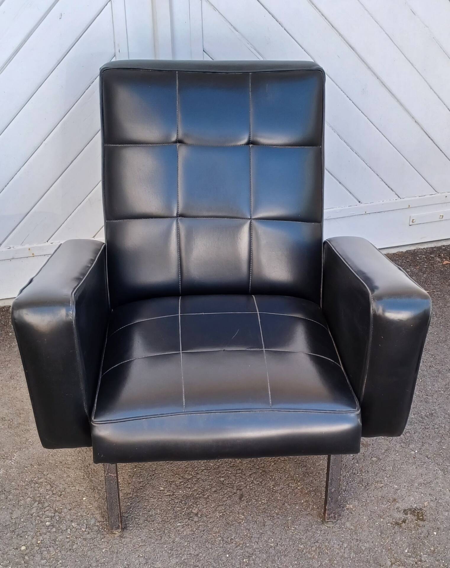 Black faux leather armchair from the 1960s
