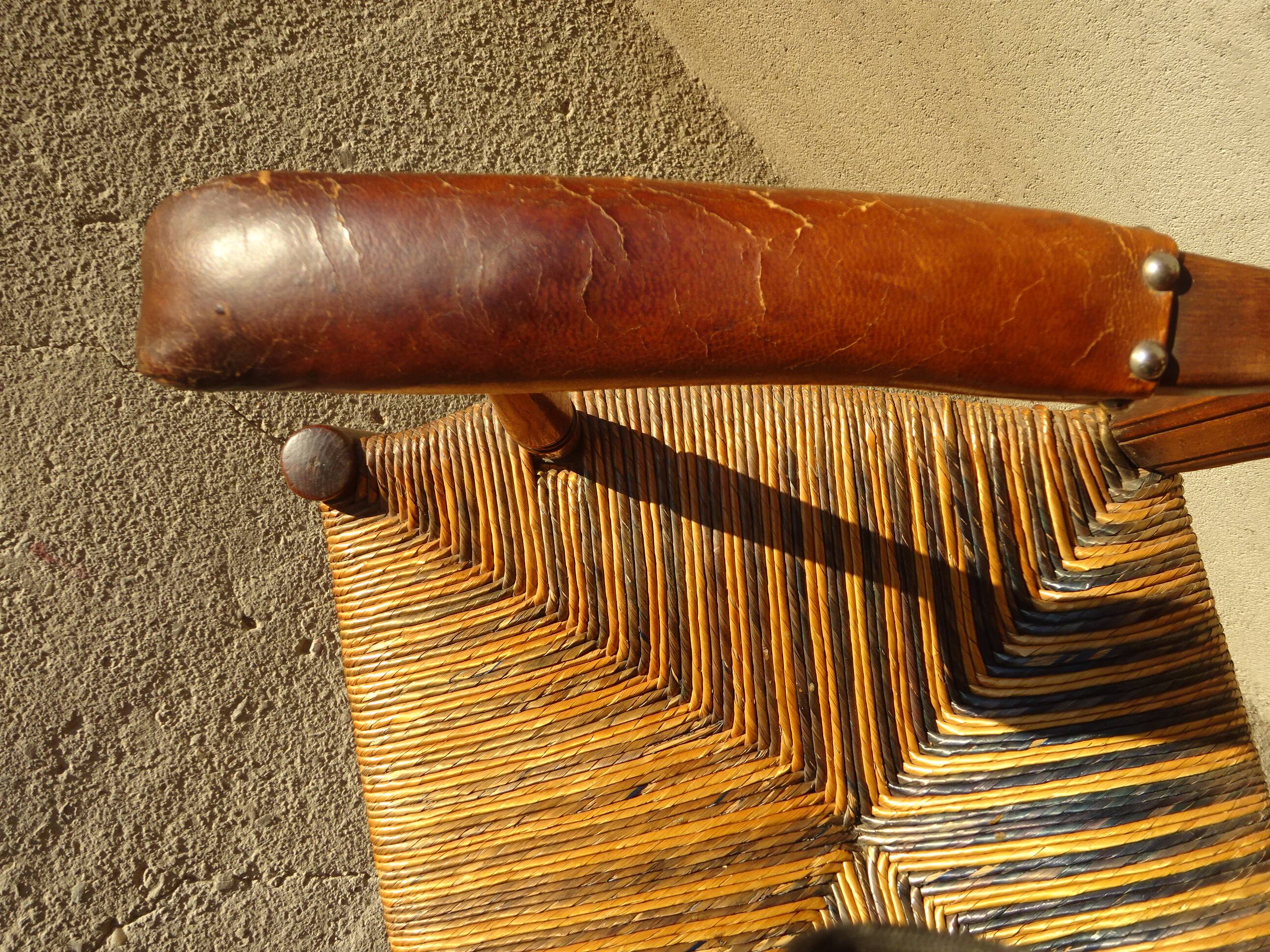 old armchair with leather armrests, from the 19th century