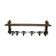 Large antique wall-mounted coat rack in wrought iron.