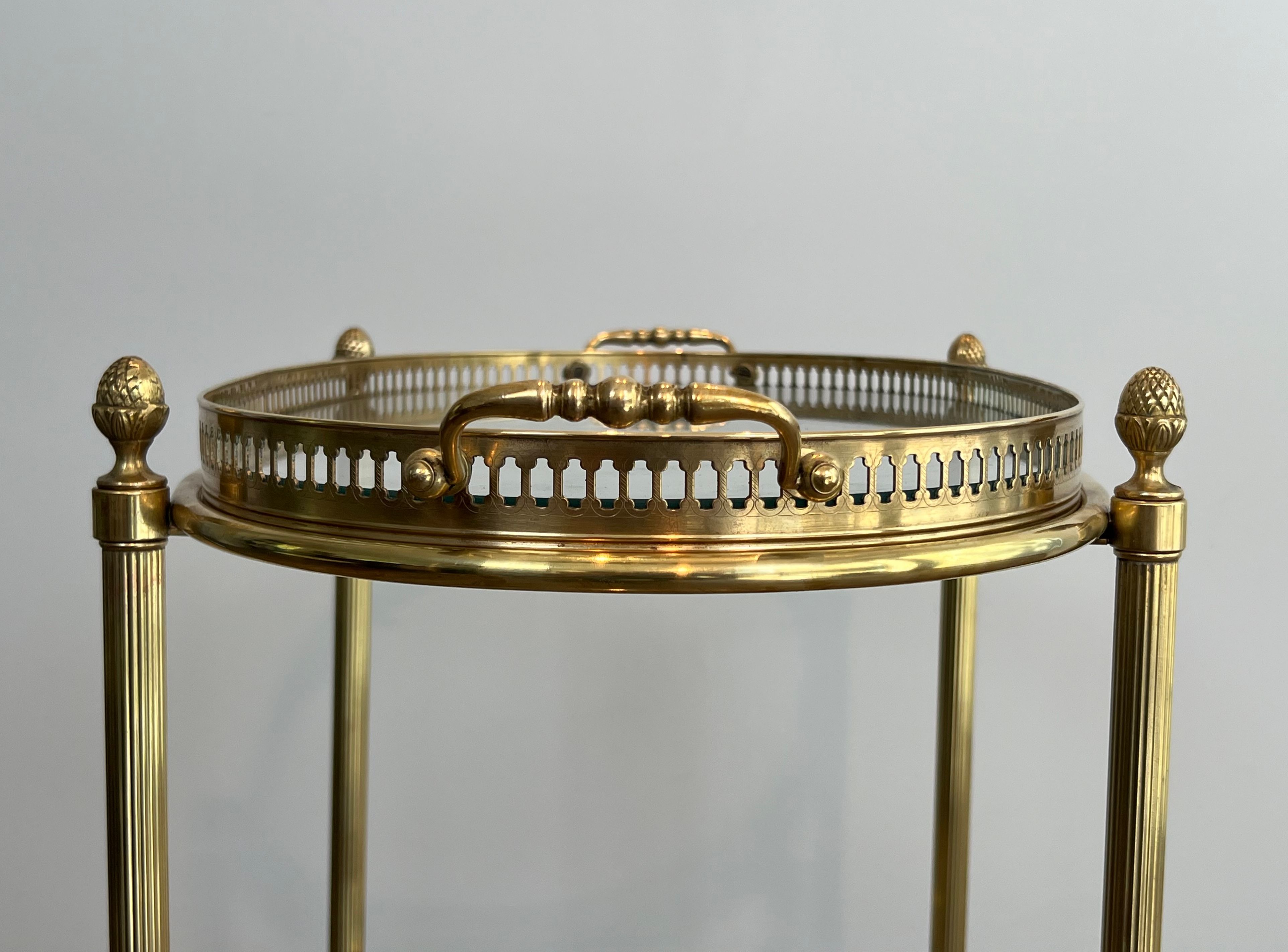 Small oval rolling table in brass with double removable trays from Maison Bagués.