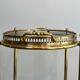 Small oval rolling table in brass with double removable trays from Maison Bagués.