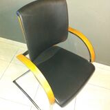 Chairs in leather, walnut and chrome