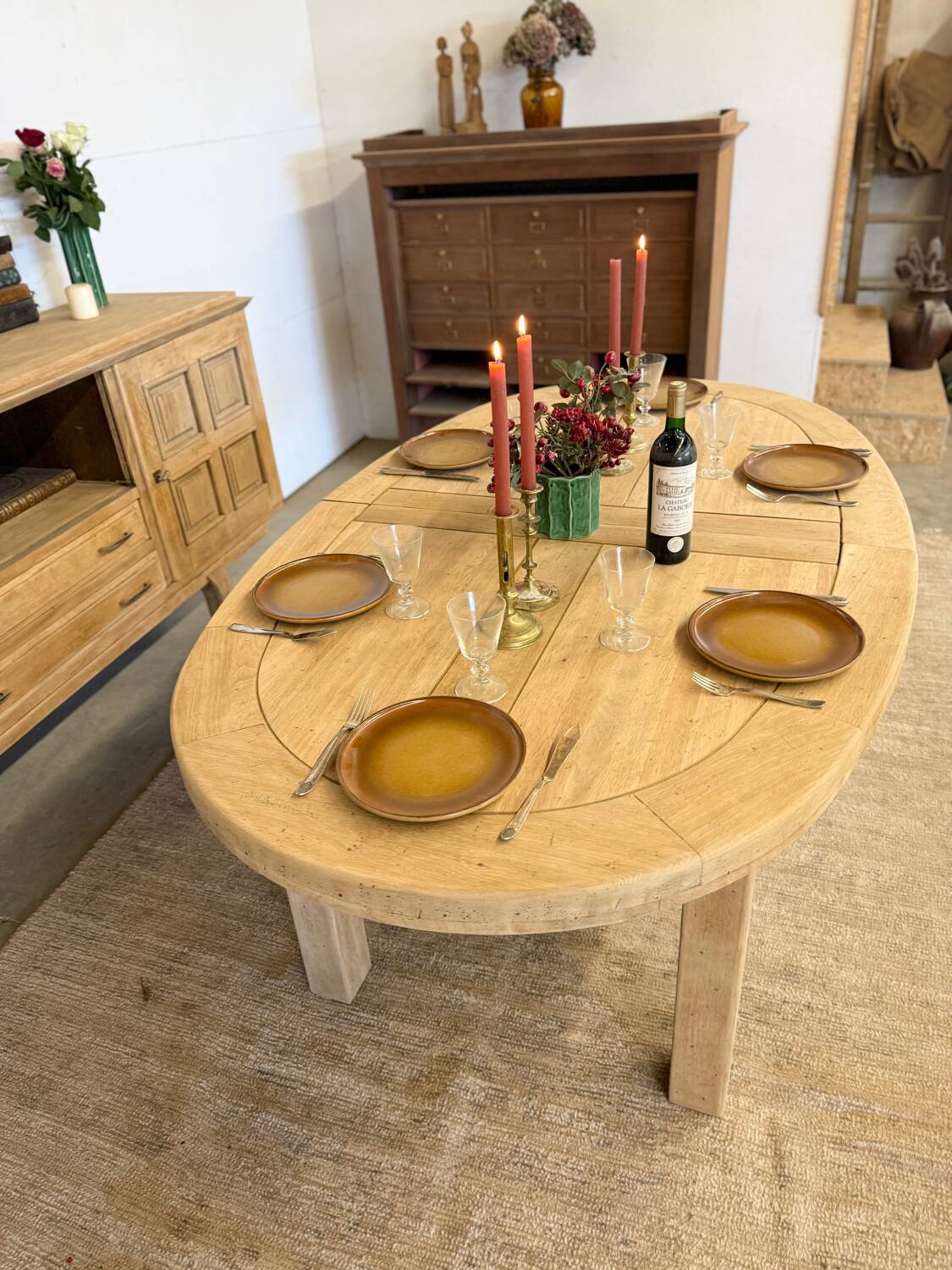 Oval farmhouse table in solid oak with extensions.