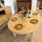 Oval farmhouse table in solid oak with extensions.