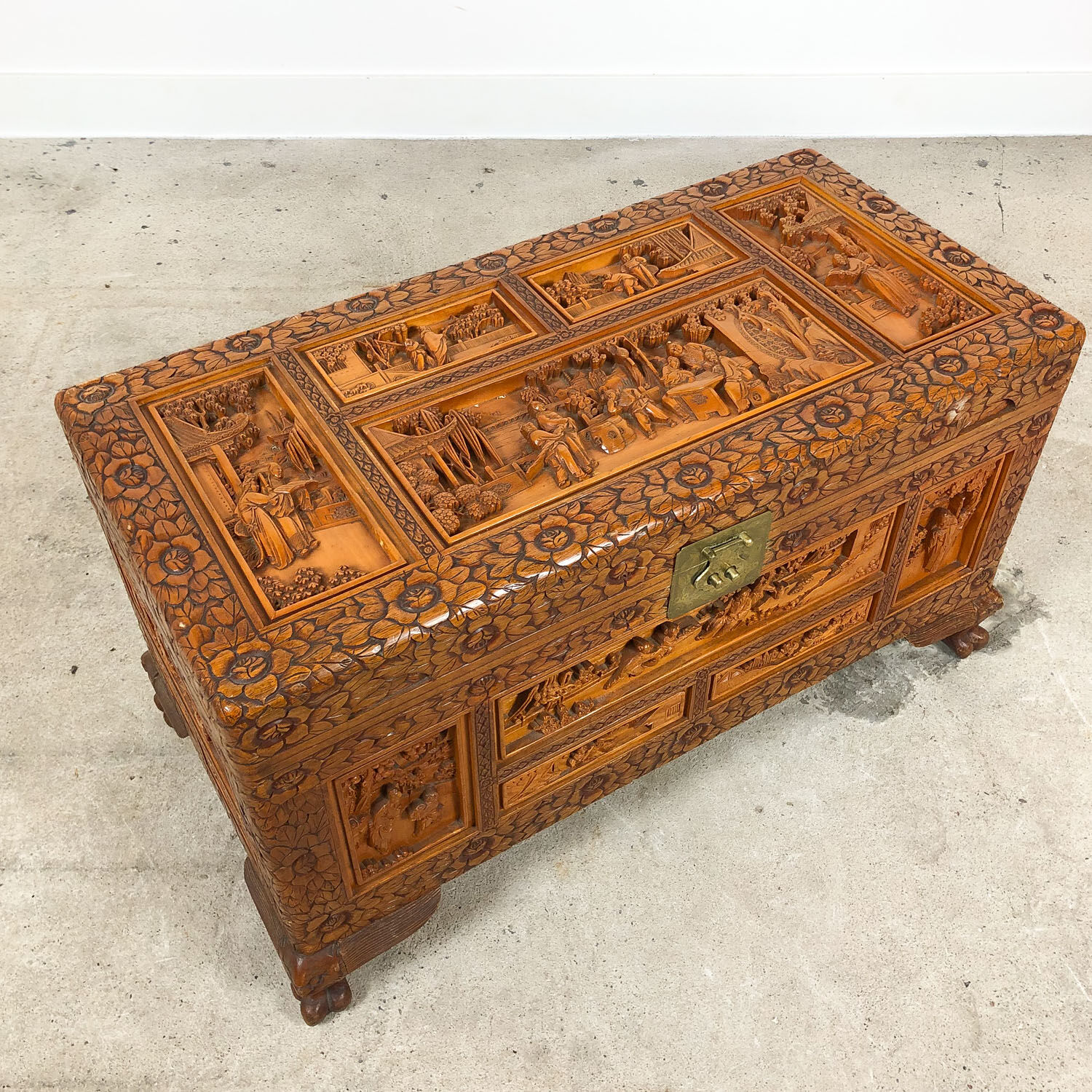 Vintage Chinese carved camphor wood chest on claw feet