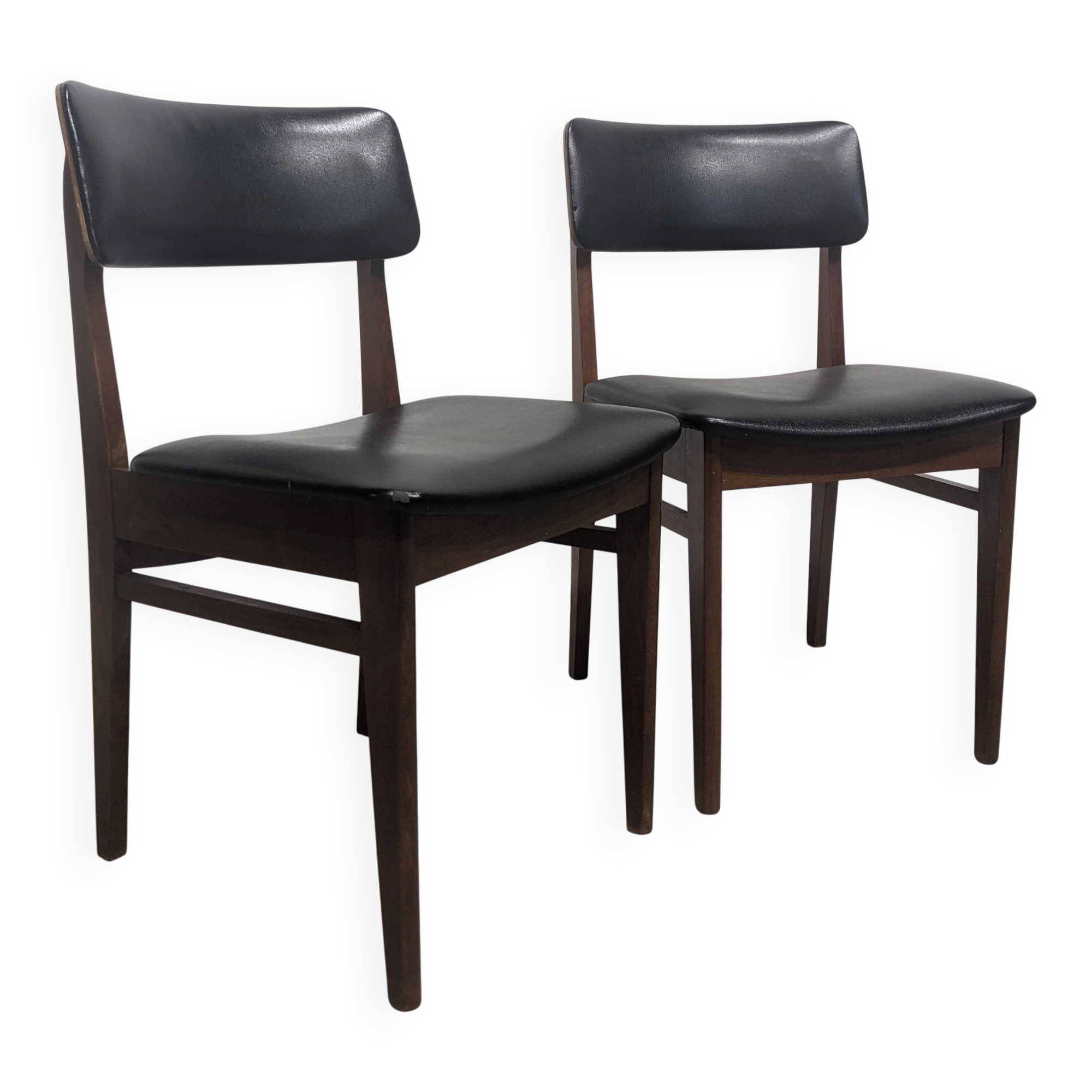 Two mid-century faux leather chairs