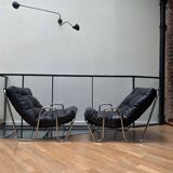 Pair of vintage armchairs in black imitation leather and chrome metal, France 1970