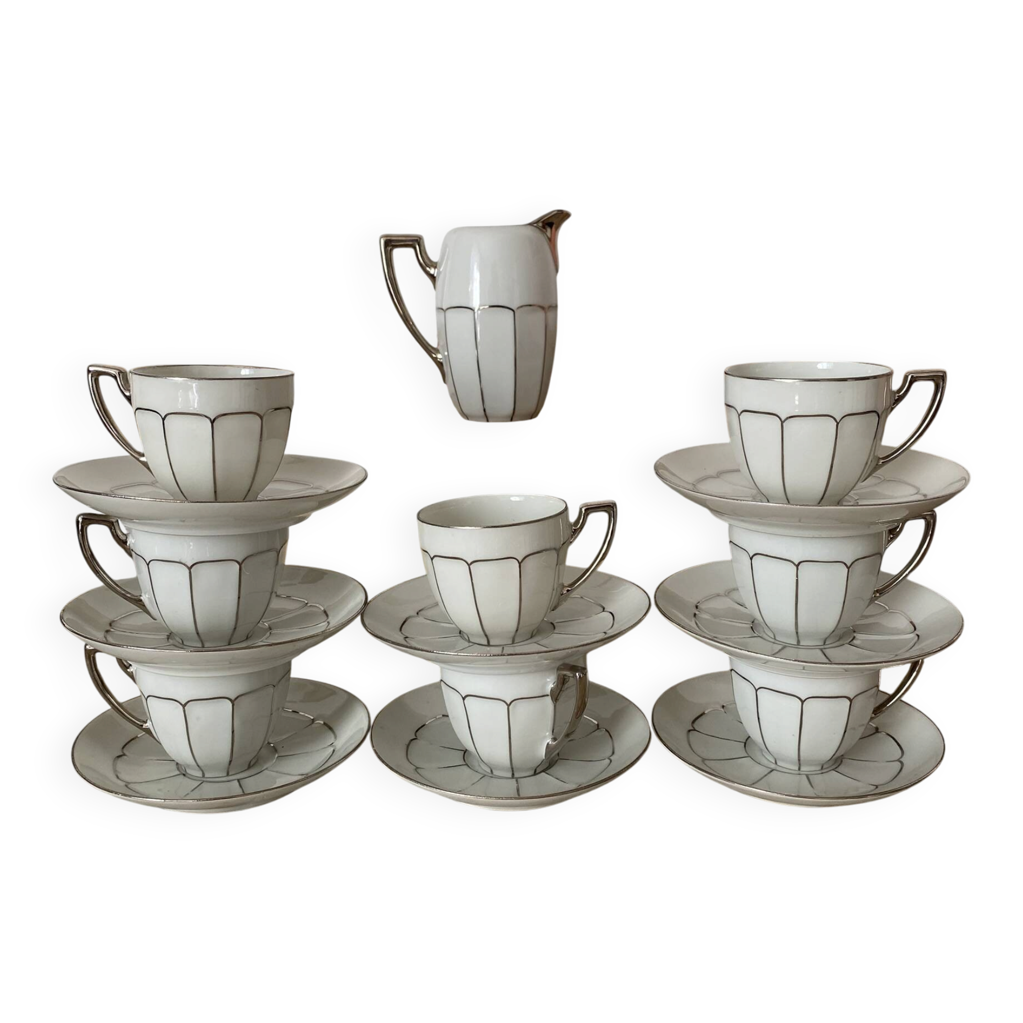 White and silver Limoges porcelain coffee cups and saucers.