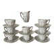 White and silver Limoges porcelain coffee cups and saucers.