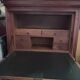Secretary desk with mahogany and flame veneer.