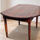 Antique dining table with drop leaves, wood.