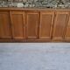 Oak workshop furniture with sliding doors.