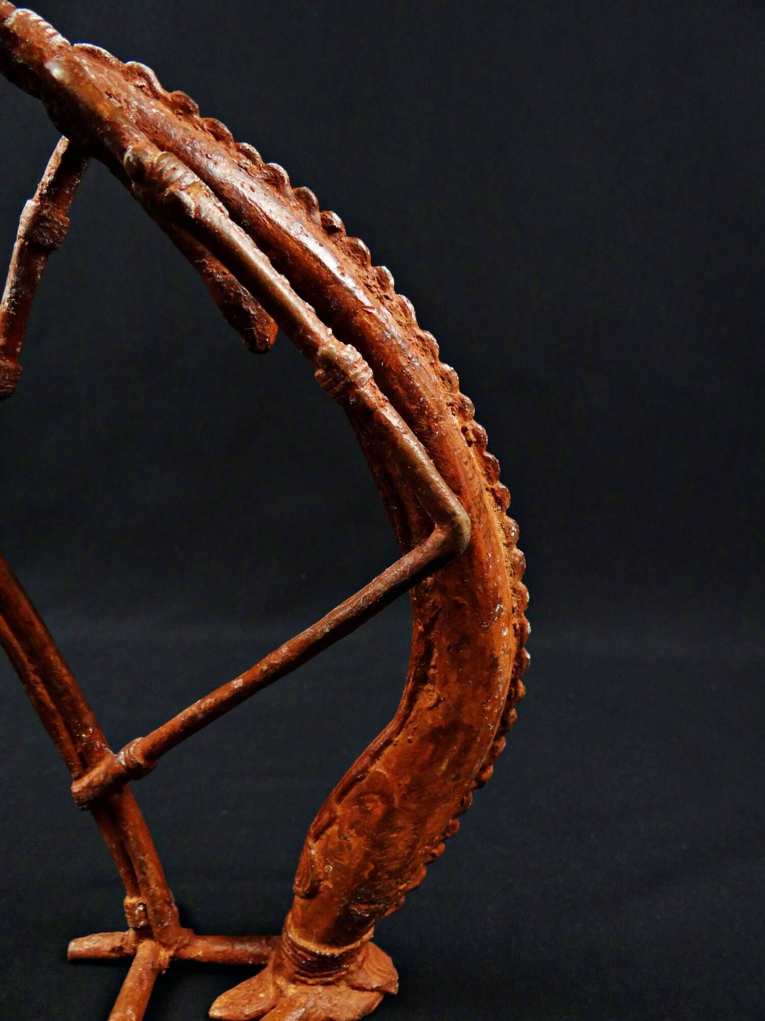 Dogon Nommo bronze statue with brown patina and red highlights, mid-20th century