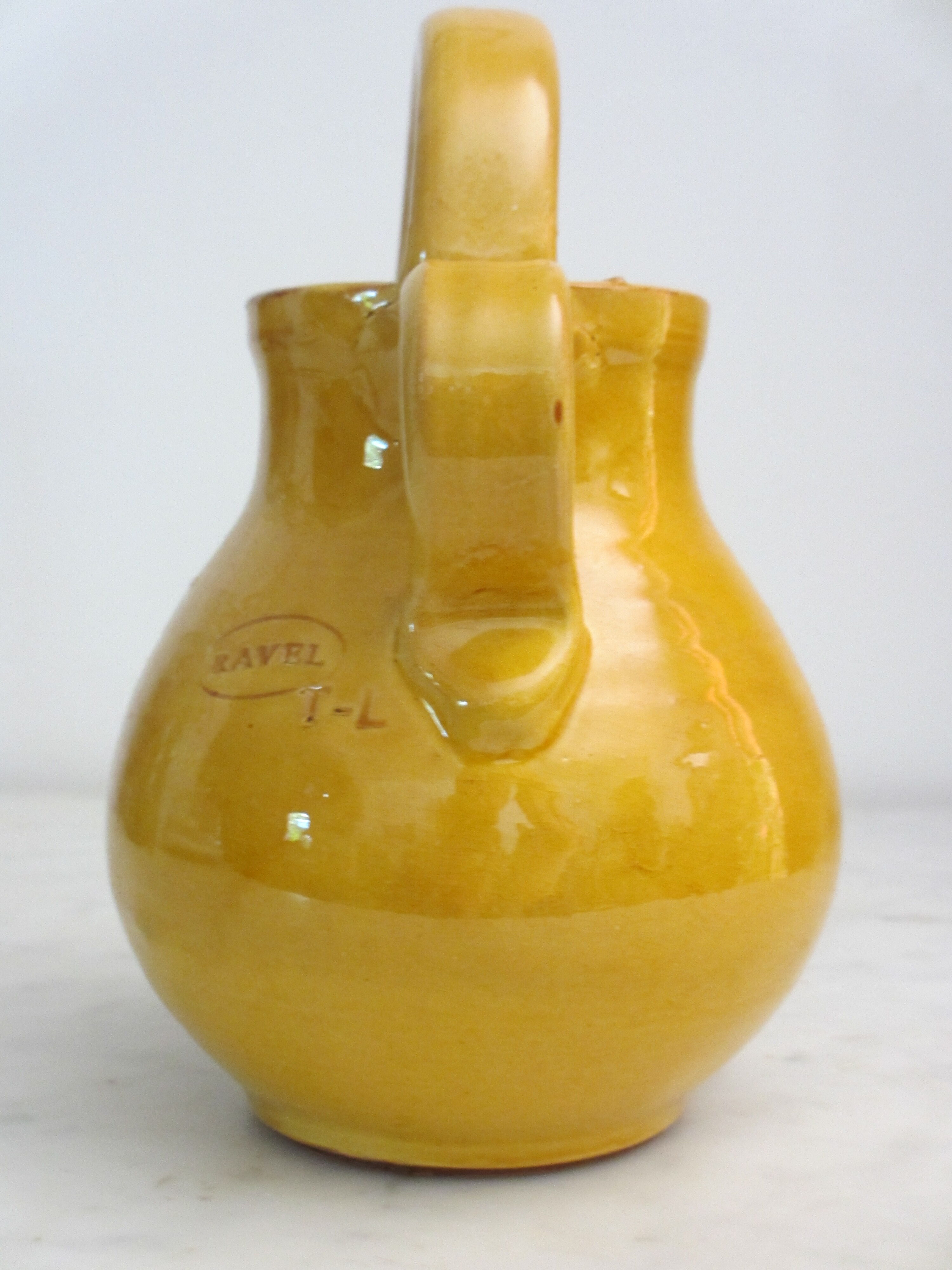 Enamelled terracotta jug