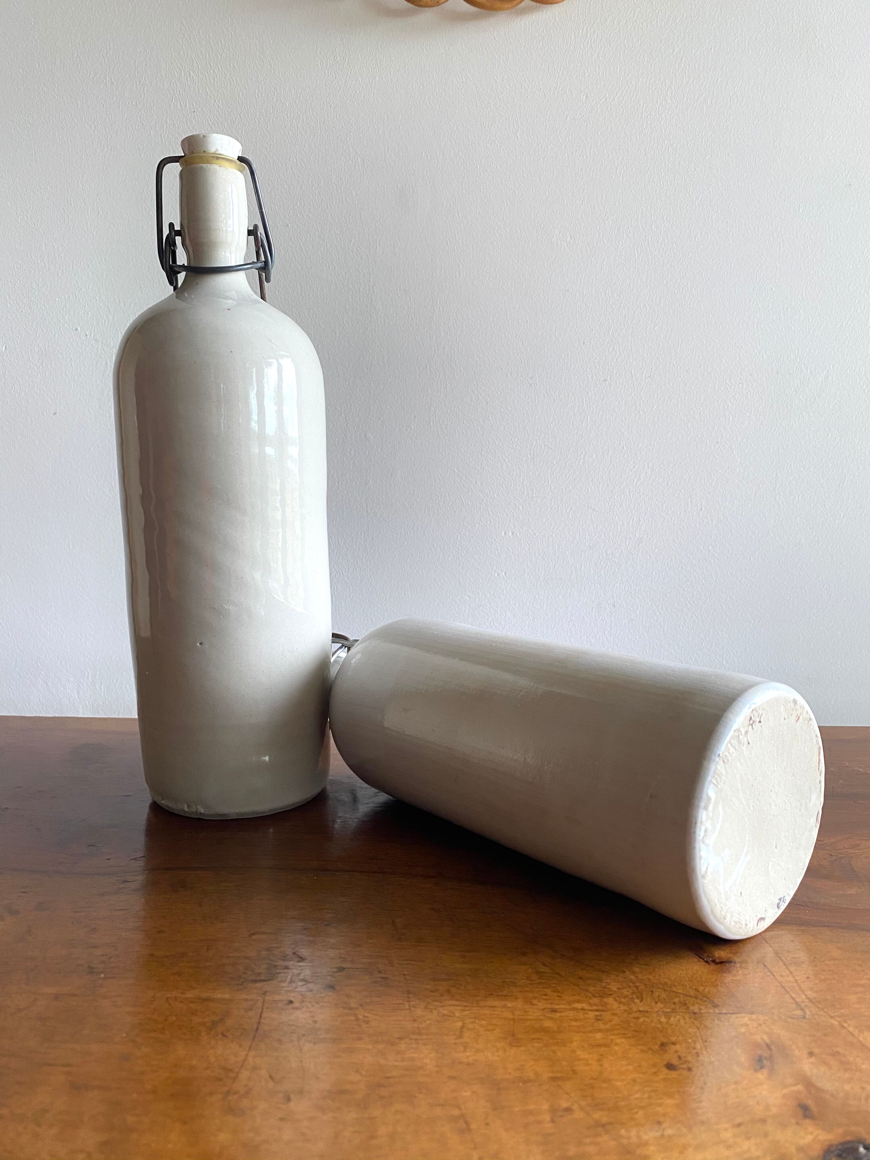 Set of 2 old bottles in glazed stoneware